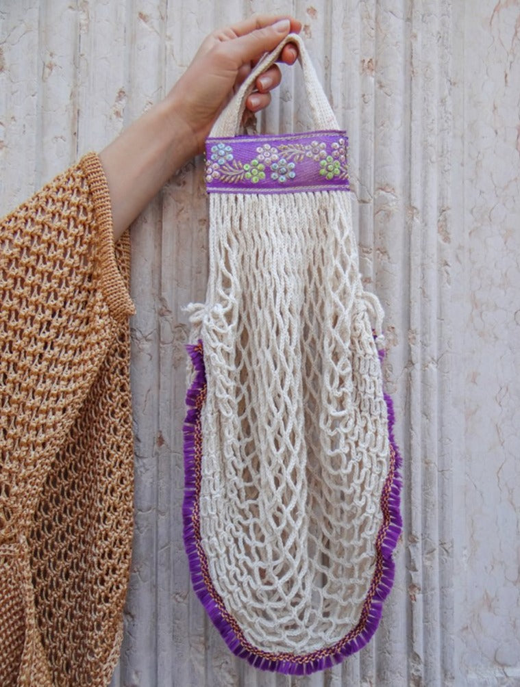 HALIA handmade cotton net bag in natural cream color with traditional ornaments and mini purple feathers.