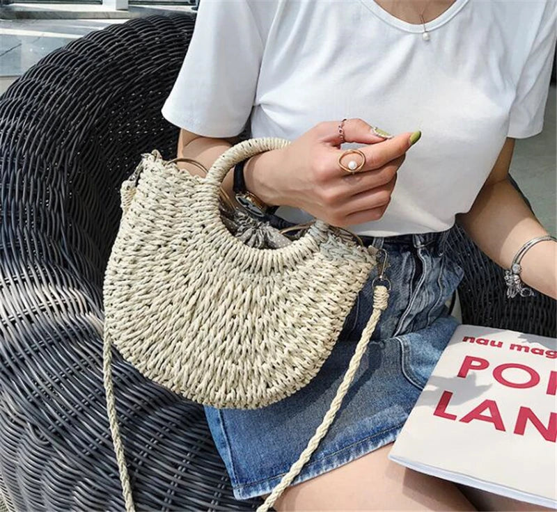 Handmade Half-Round Rattan Woven Straw Bag showcasing its unique half-moon shape and natural straw material, perfect for bohemian style.