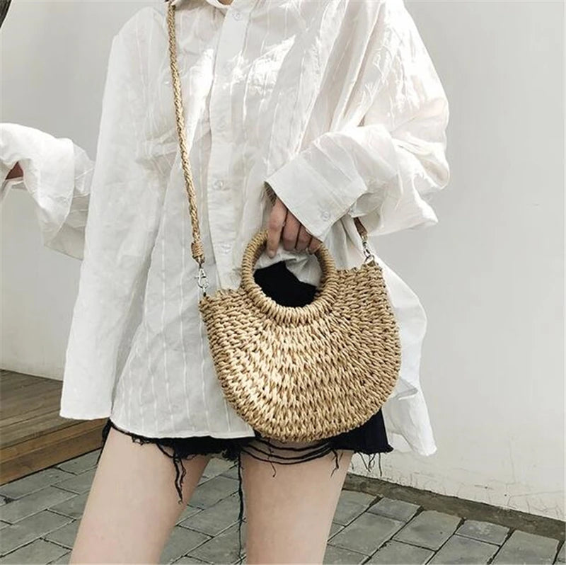 Handmade Half-Round Rattan Woven Straw Bag showcasing its unique half-moon shape and natural straw material, perfect for bohemian style.