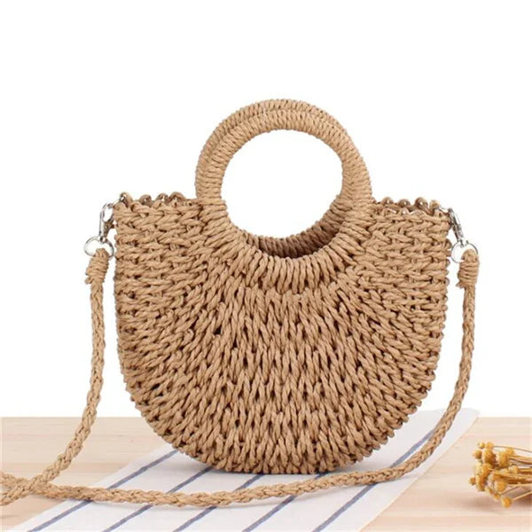 Handmade Half-Round Rattan Woven Straw Bag showcasing its unique half-moon shape and natural straw material, perfect for bohemian style.