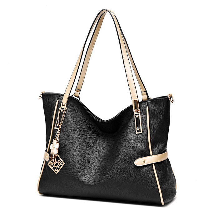 High Quality Large Capacity Handbag for Women in soft PU material, featuring a zipper closure and spacious interior with pockets for organization.