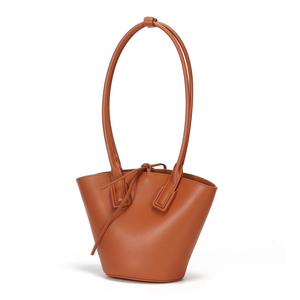 High Quality Women's Special Fashion Shoulder Bag in bucket shape, made from cowhide and polyester cotton, showcasing its stylish design and compact size.