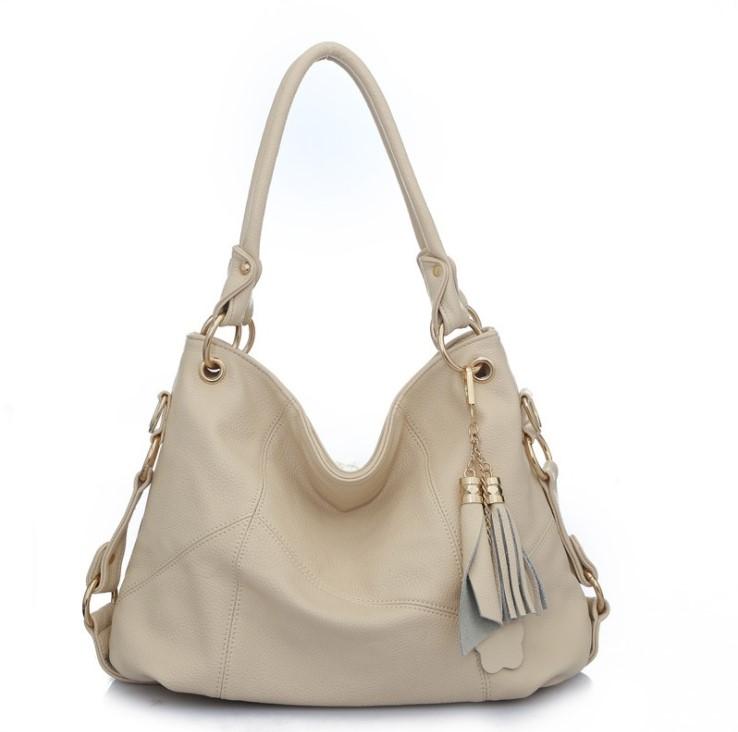 Huma Vegan HandBag featuring pebble texture, multiple zippered pockets, and available in five colors including Creamy White and Classic Khaki.