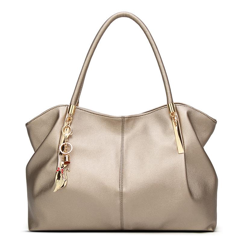 Large capacity solid color fashion handbag for women, featuring a stylish dumpling shape and multiple internal pockets.