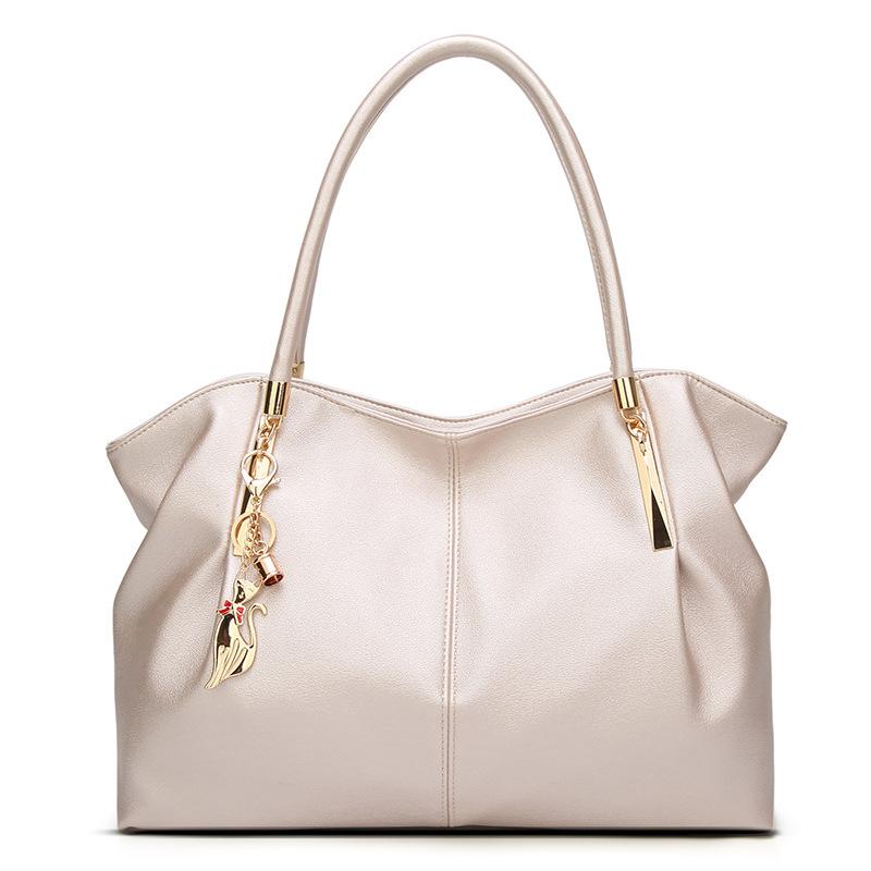 Large capacity solid color fashion handbag for women, featuring a stylish dumpling shape and multiple internal pockets.