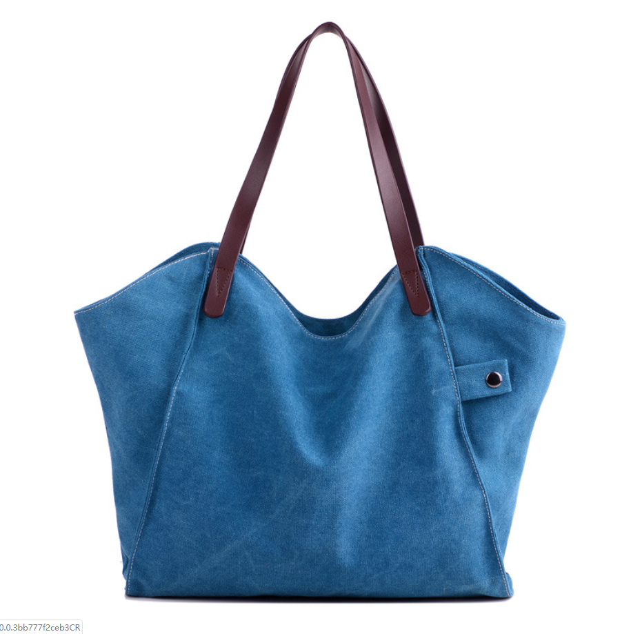 Large-capacity canvas shoulder bag for women, featuring a stylish design with soft handles and multiple pockets for organization.