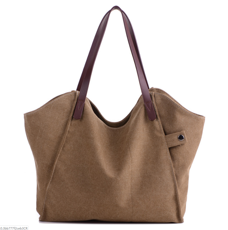 Large-capacity canvas shoulder bag for women, featuring a stylish design with soft handles and multiple pockets for organization.