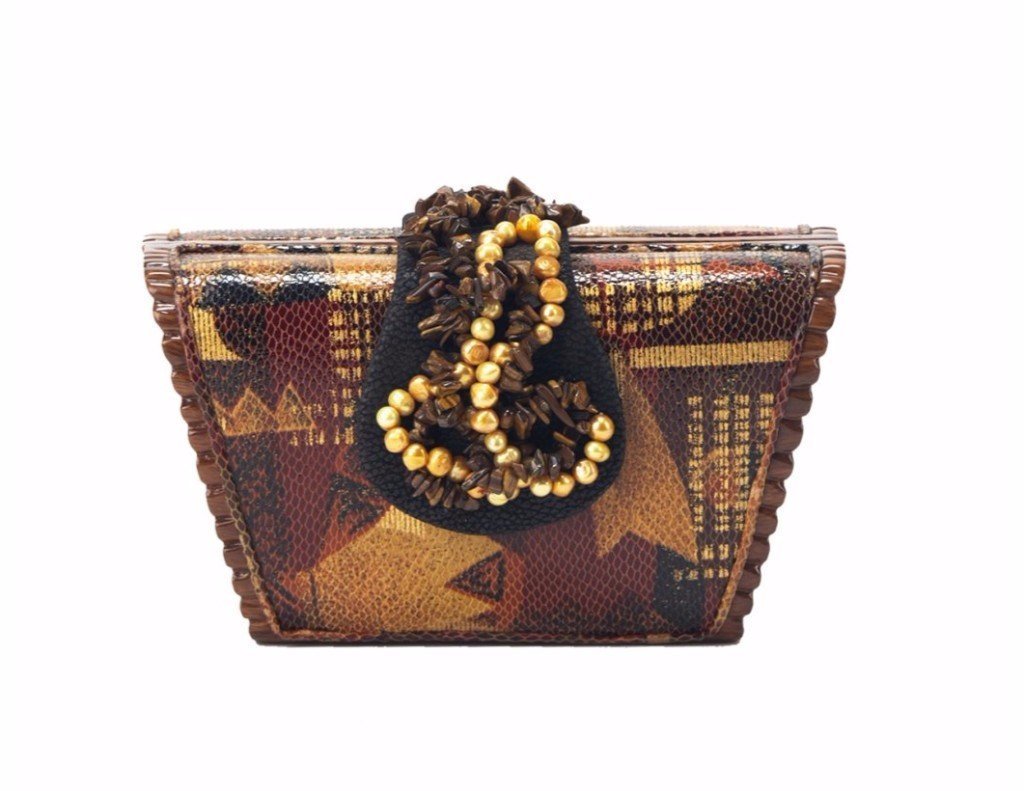 Melinda handbag featuring carved Acacia wood, geometric leather overlay in gold, burgundy, and black, with a custom leather flap and beads.