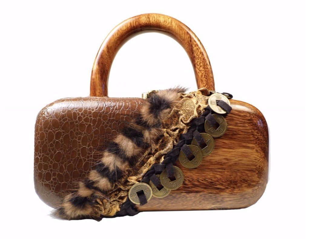 Mirelle handbag featuring carved Acacia wood, textured leather, faux fur accents, and I Ching coins with a stylish wood handle.