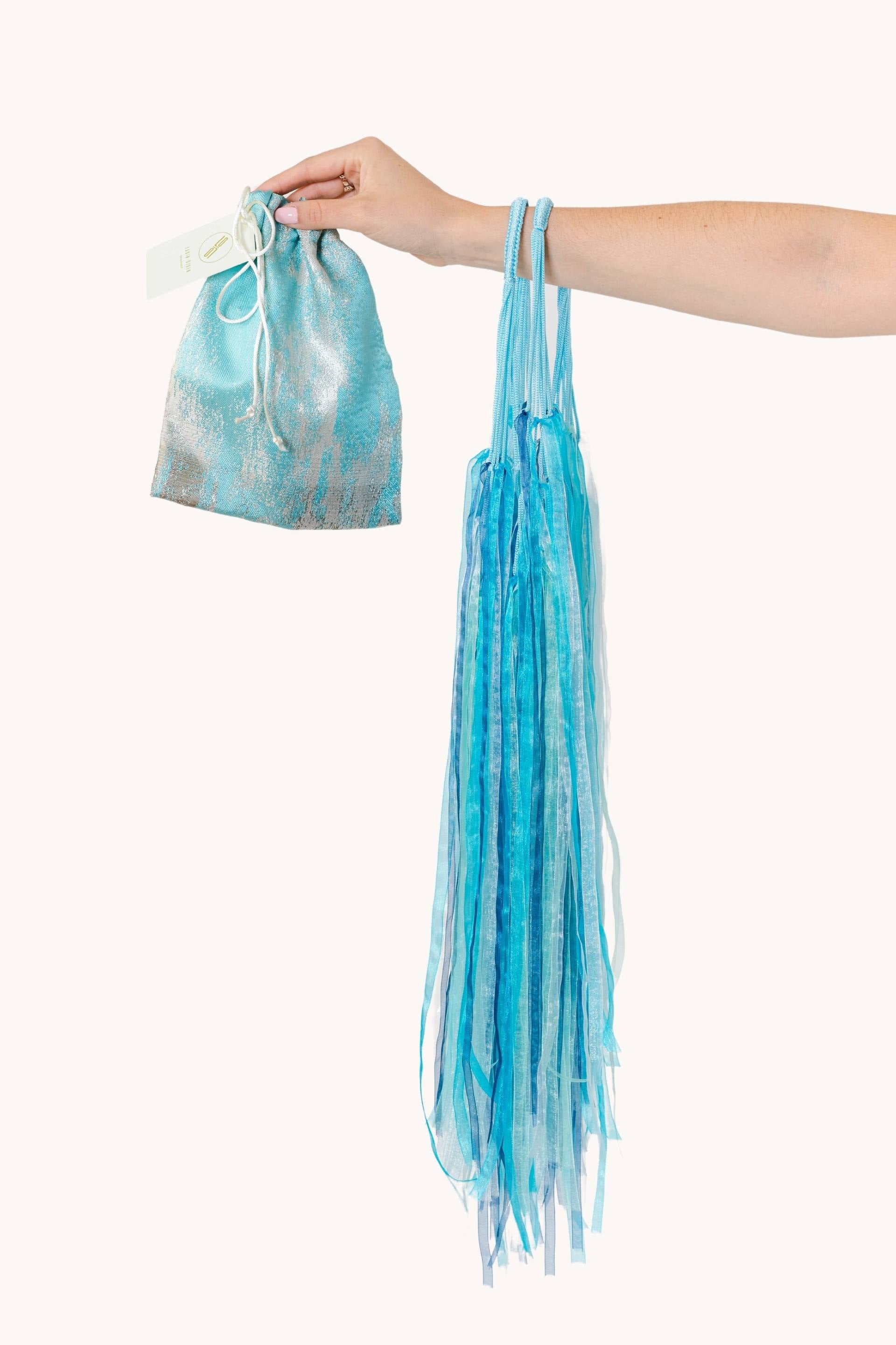 Cyan cotton net bag with turquoise ribbons, inspired by moon jellyfish, featuring a pouch bag inside.