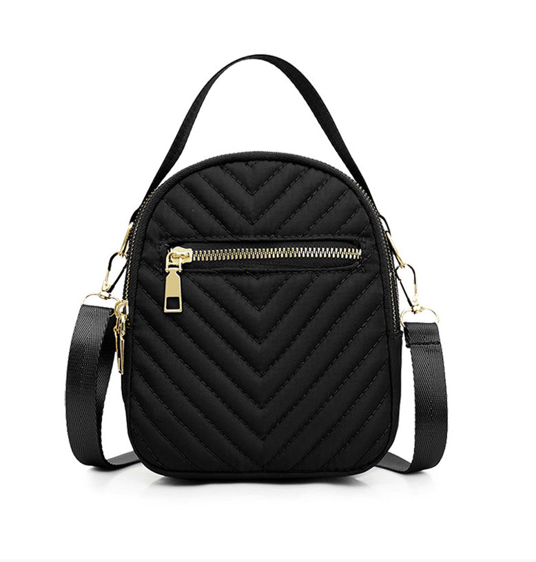 A stylish nylon quilted bag featuring multiple zipper pockets, adjustable strap, and gold-tone hardware.