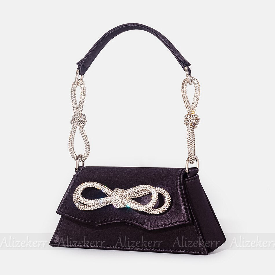 Elegant Order 5 bag made of soft satin with flap design, adorned with bow and diamonds, perfect for versatile occasions.