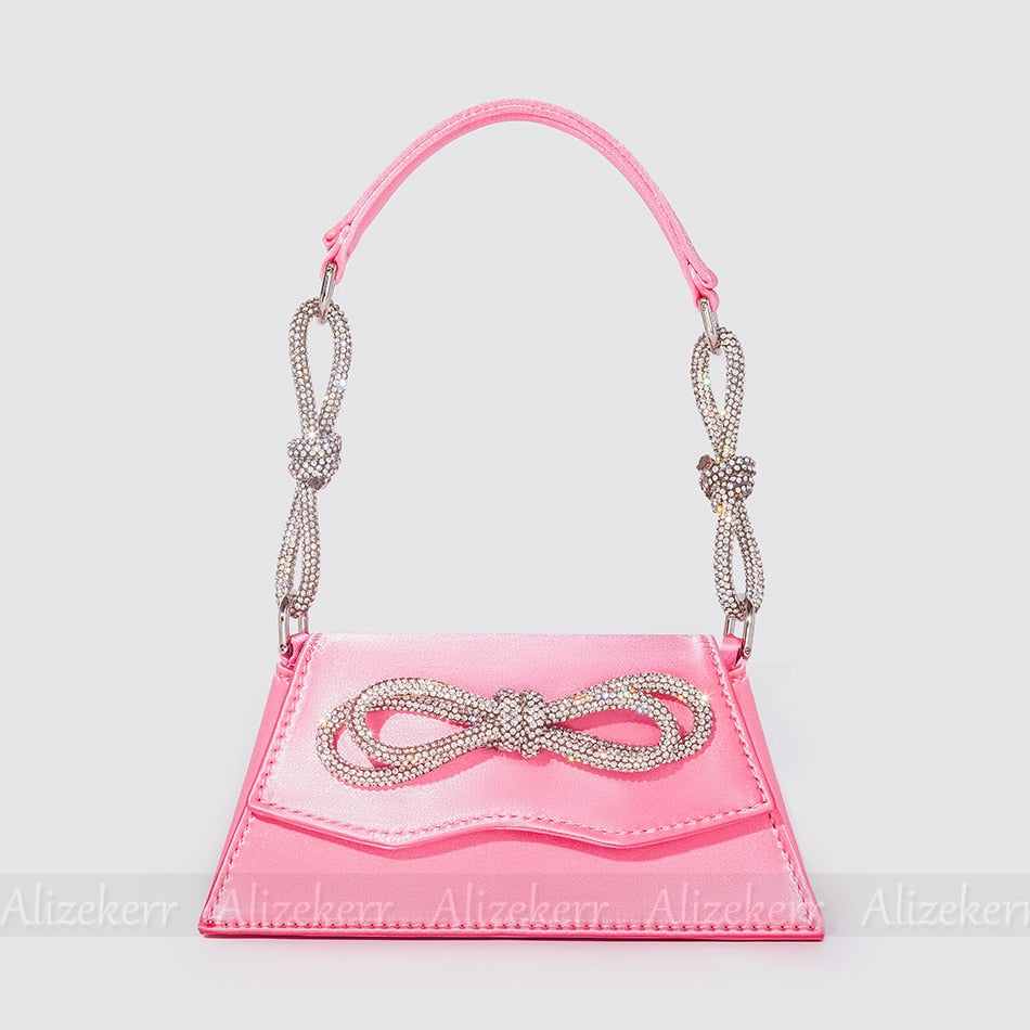 Elegant Order 5 bag made of soft satin with flap design, adorned with bow and diamonds, perfect for versatile occasions.