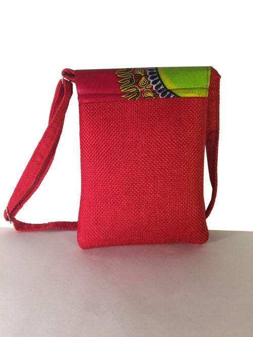 A vibrant maroon Shoulder Khanga Bag featuring traditional African Kitengi fabric flap and hessian woven body, ideal for laptops and daily essentials.