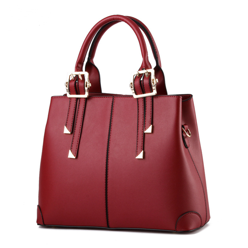 A stylish solid color women's handbag made of PU fabric, featuring embossed detailing, a zipper opening, and multiple internal pockets for organization.