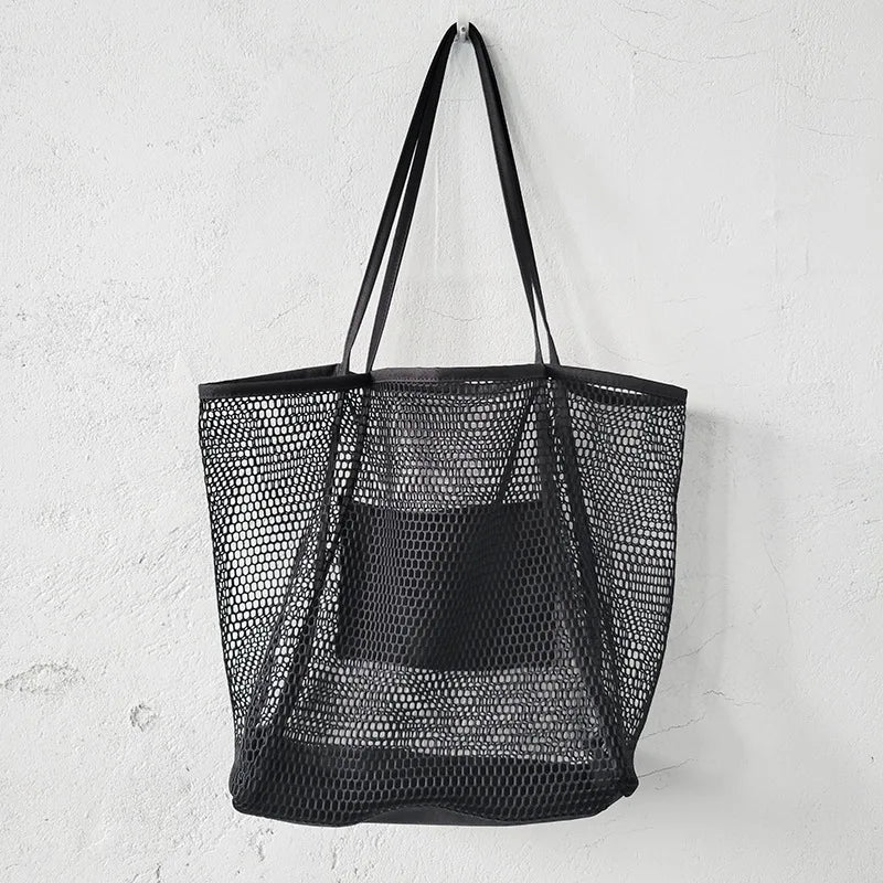 A large capacity hollow mesh tote bag in solid color, perfect for travel and beach outings, showcasing its lightweight and foldable design.