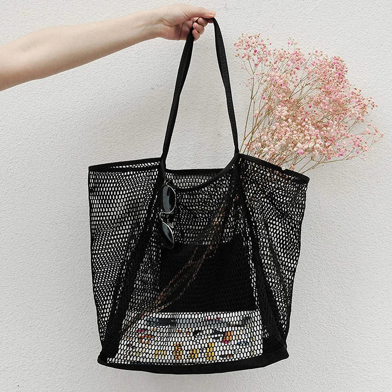 A large capacity hollow mesh tote bag in solid color, perfect for travel and beach outings, showcasing its lightweight and foldable design.