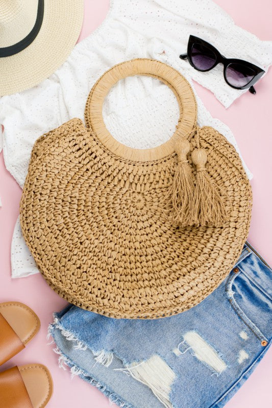 Stylish Straw Tassel O-Ring Tote with woven design and tassel accent, perfect for casual outings.