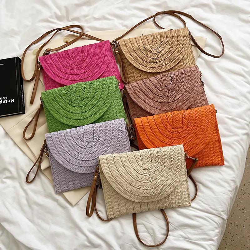 Stylish straw woven shoulder crossbody beach clutch bag for women, featuring a flap design and cell phone pocket.