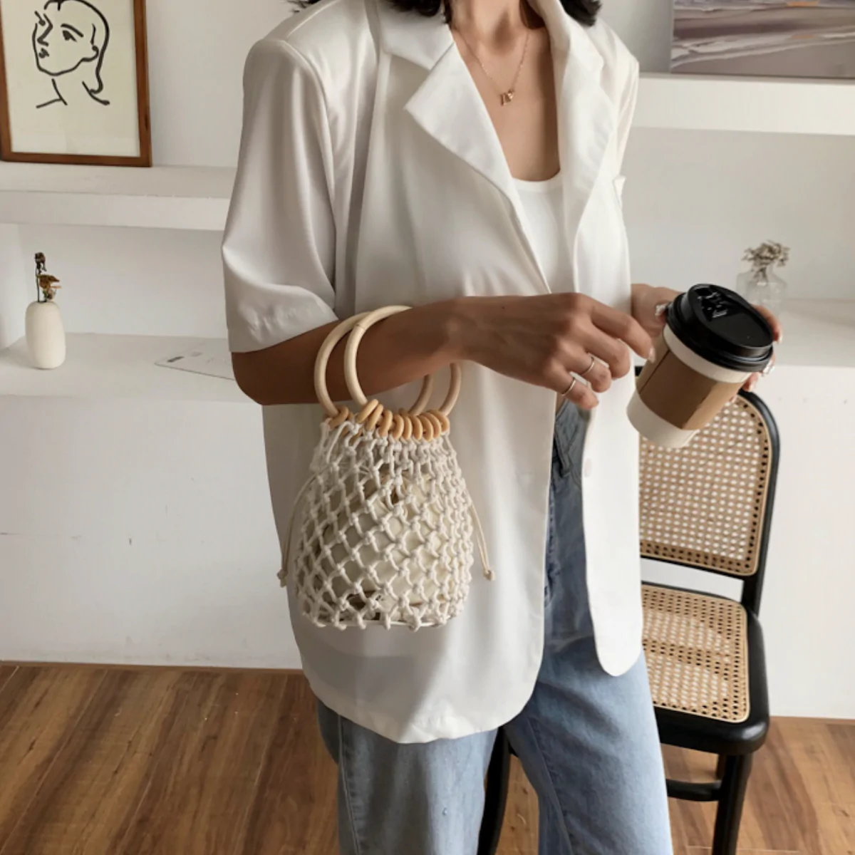 A stylish Summer Crochet Bag featuring a ratten ring handle, made from eco-friendly cotton rope and vegan leather, available in brown and off-white.