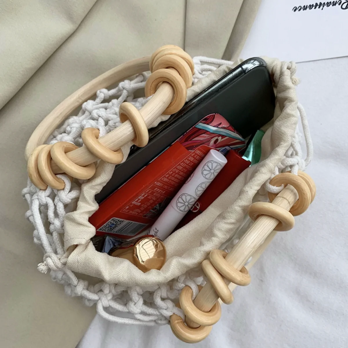 A stylish Summer Crochet Bag featuring a ratten ring handle, made from eco-friendly cotton rope and vegan leather, available in brown and off-white.