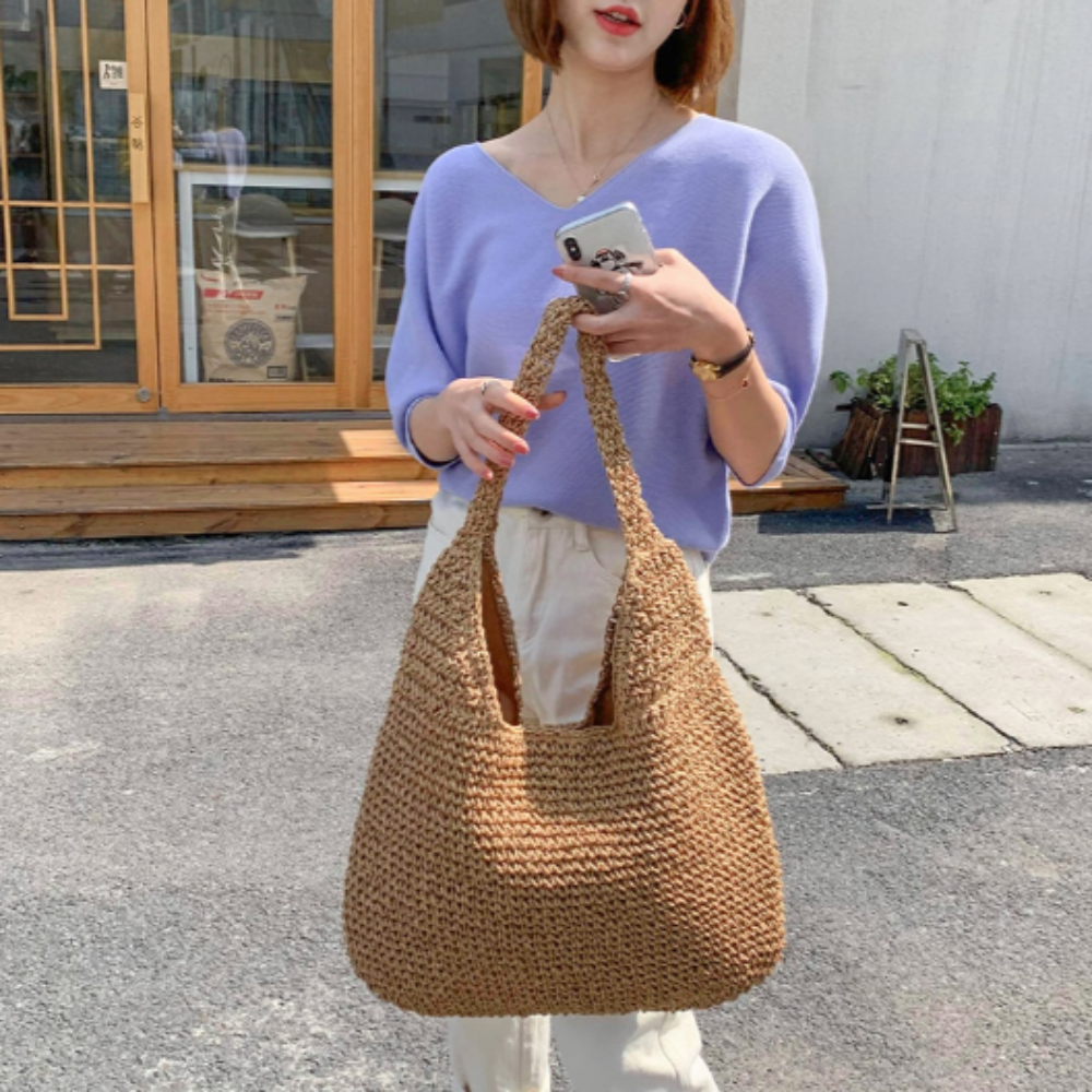 A stylish Summer Shoulder Straw Tote made of durable straw material, featuring a spacious interior and a trendy design, perfect for summer outings.