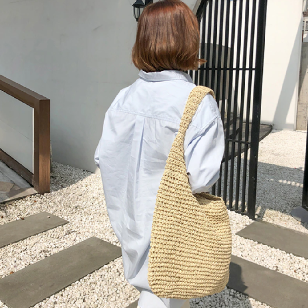 A stylish Summer Shoulder Straw Tote made of durable straw material, featuring a spacious interior and a trendy design, perfect for summer outings.