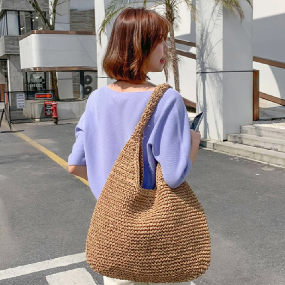 A stylish Summer Shoulder Straw Tote made of durable straw material, featuring a spacious interior and a trendy design, perfect for summer outings.