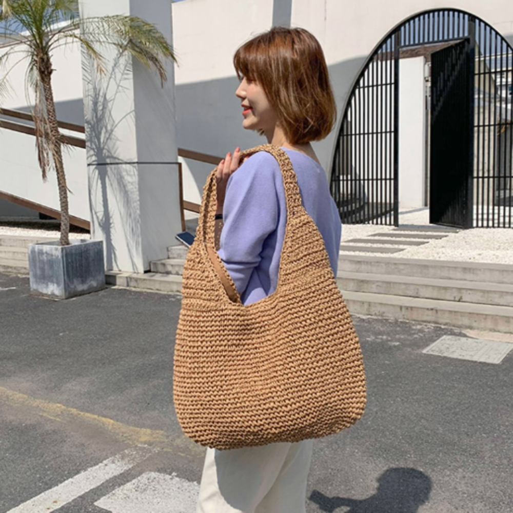 A stylish Summer Shoulder Straw Tote made of durable straw material, featuring a spacious interior and a trendy design, perfect for summer outings.