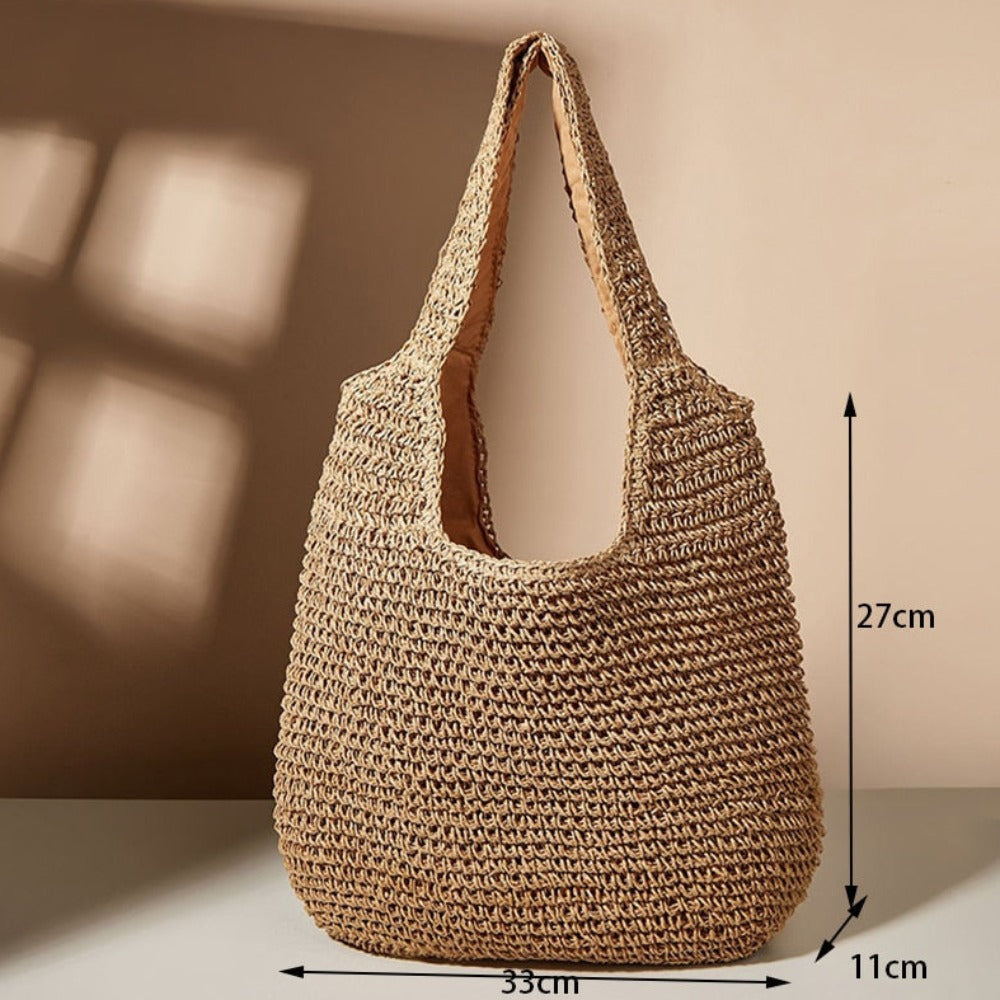 A stylish Summer Shoulder Straw Tote made of durable straw material, featuring a spacious interior and a trendy design, perfect for summer outings.