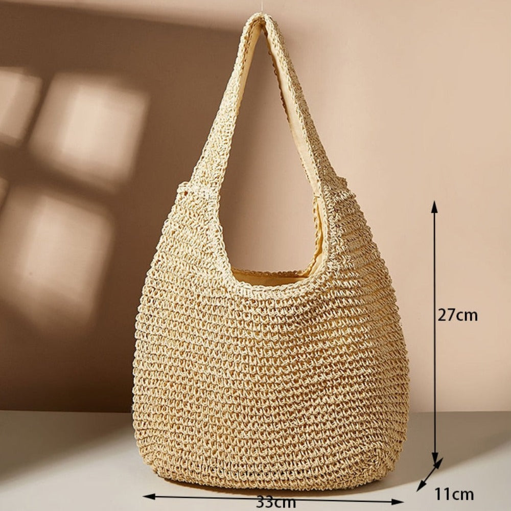 A stylish Summer Shoulder Straw Tote made of durable straw material, featuring a spacious interior and a trendy design, perfect for summer outings.