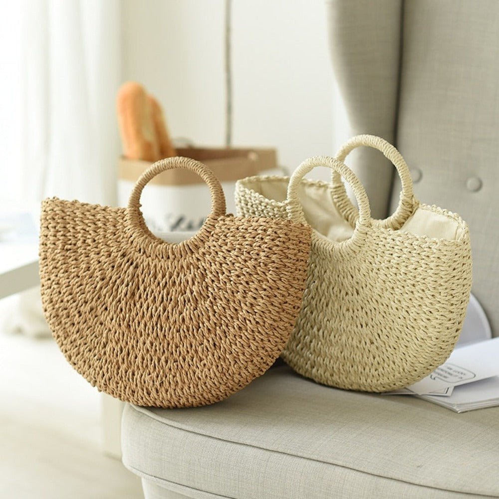 A stylish Summer Top Handle Semi Circle Straw Bag, showcasing its trendy semi-circle shape and lightweight straw material, perfect for summer outings.