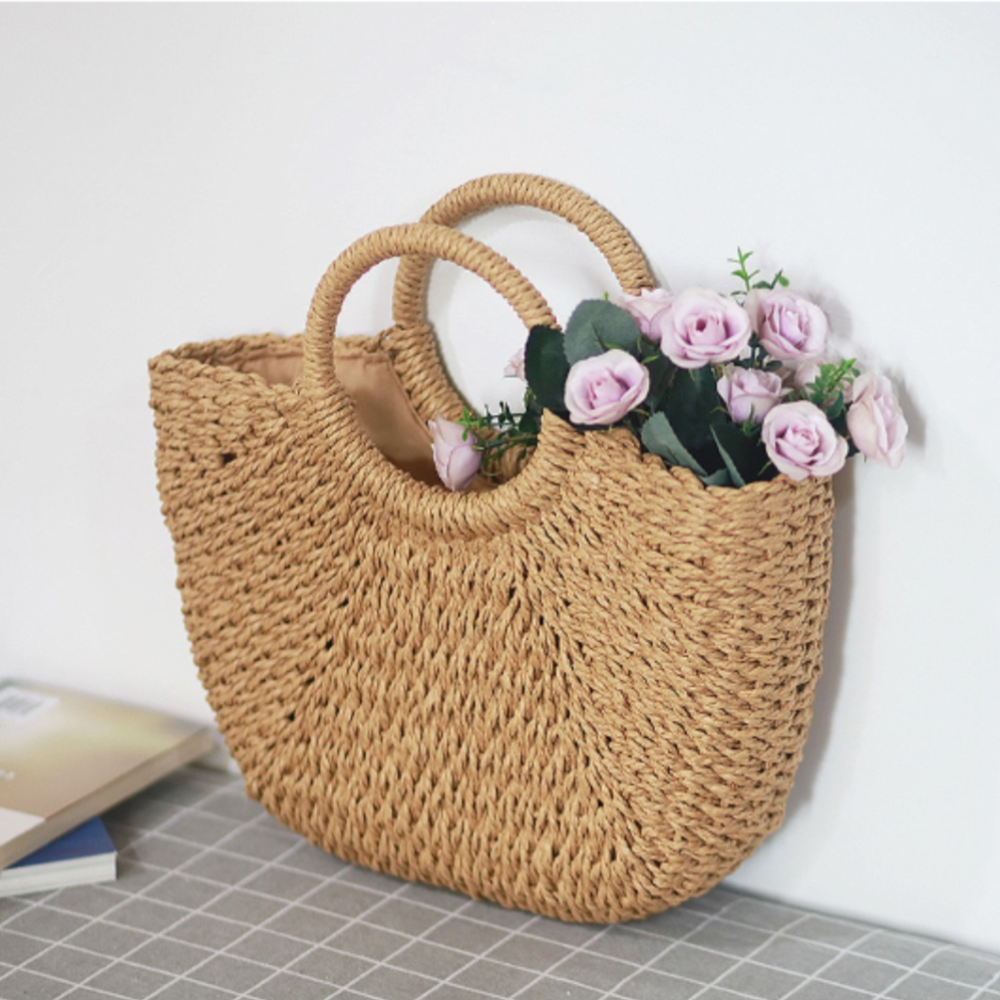 A stylish Summer Top Handle Semi Circle Straw Bag, showcasing its trendy semi-circle shape and lightweight straw material, perfect for summer outings.