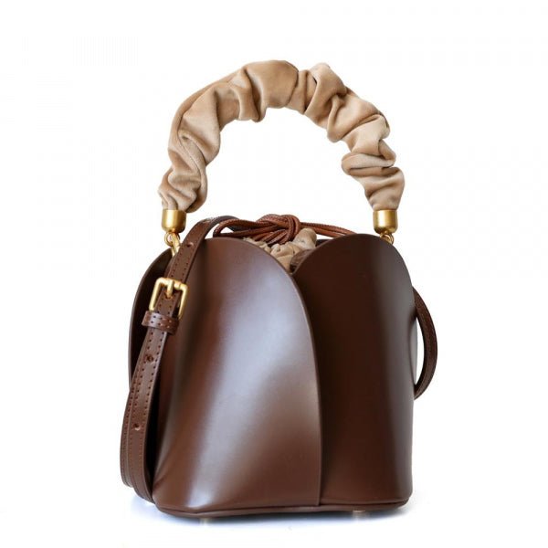 Tulip Leather Bucket bag featuring a unique four-bladed design and frilled handle, made from genuine leather.