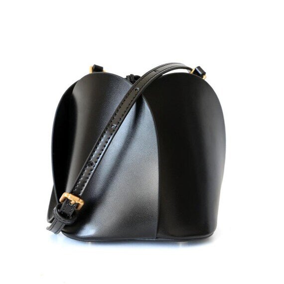 Tulip Leather Bucket bag featuring a unique four-bladed design and frilled handle, made from genuine leather.