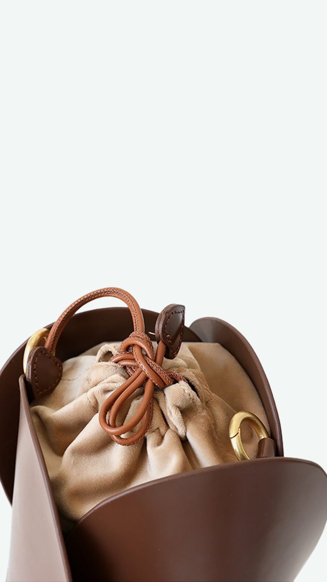 Tulip Leather Bucket bag featuring a unique four-bladed design and frilled handle, made from genuine leather.