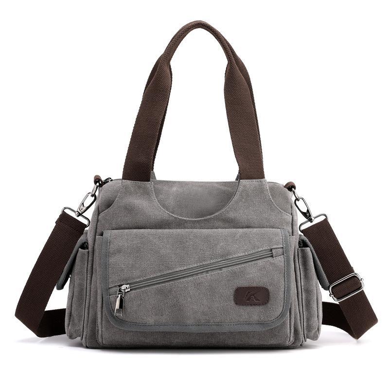 Unisex Casual Canvas Messenger Bag in a stylish design, showcasing its durable canvas fabric and spacious interior, perfect for trips.