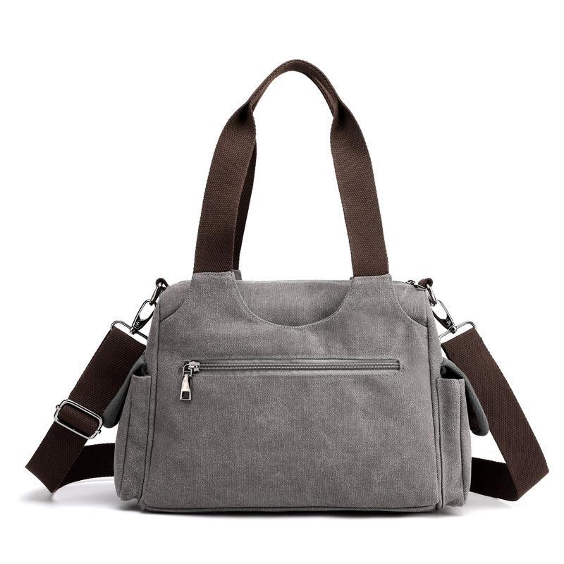 Unisex Casual Canvas Messenger Bag in a stylish design, showcasing its durable canvas fabric and spacious interior, perfect for trips.