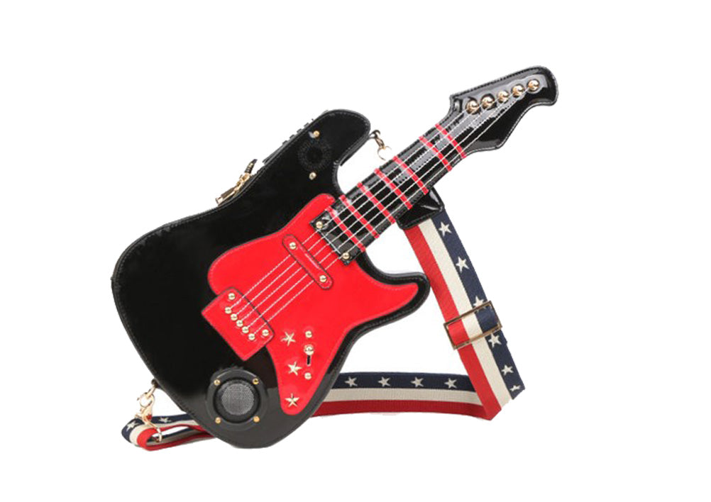 A stylish black and red guitar-shaped handbag with Bluetooth speakers, featuring golden hardware and dual zippers.