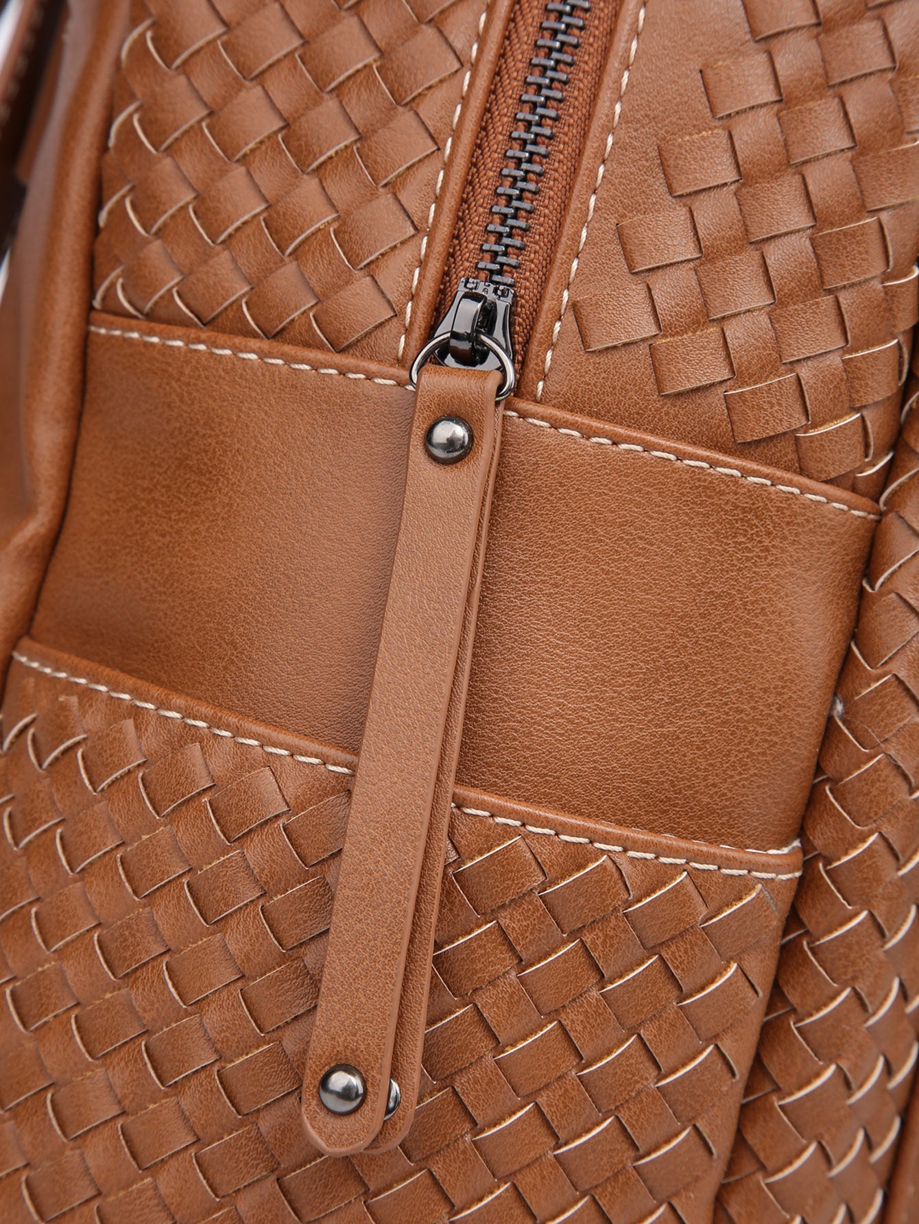 Stylish brown woven backpack purse for women made from vegan leather, showcasing intricate handmade craftsmanship.