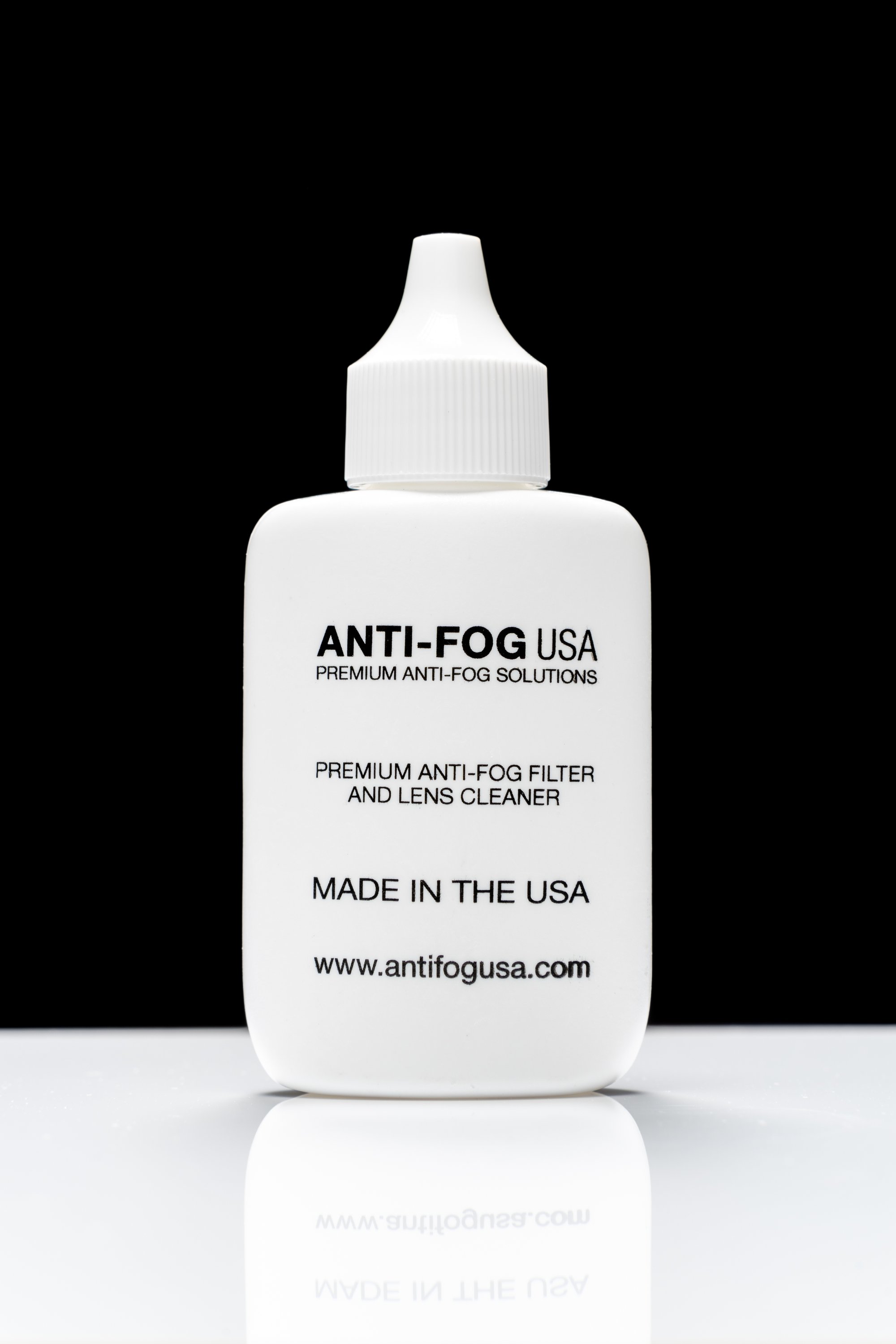 Anti-Fog Spray in a 1 oz. dropper bottle, designed for lens cleaning and fog prevention.