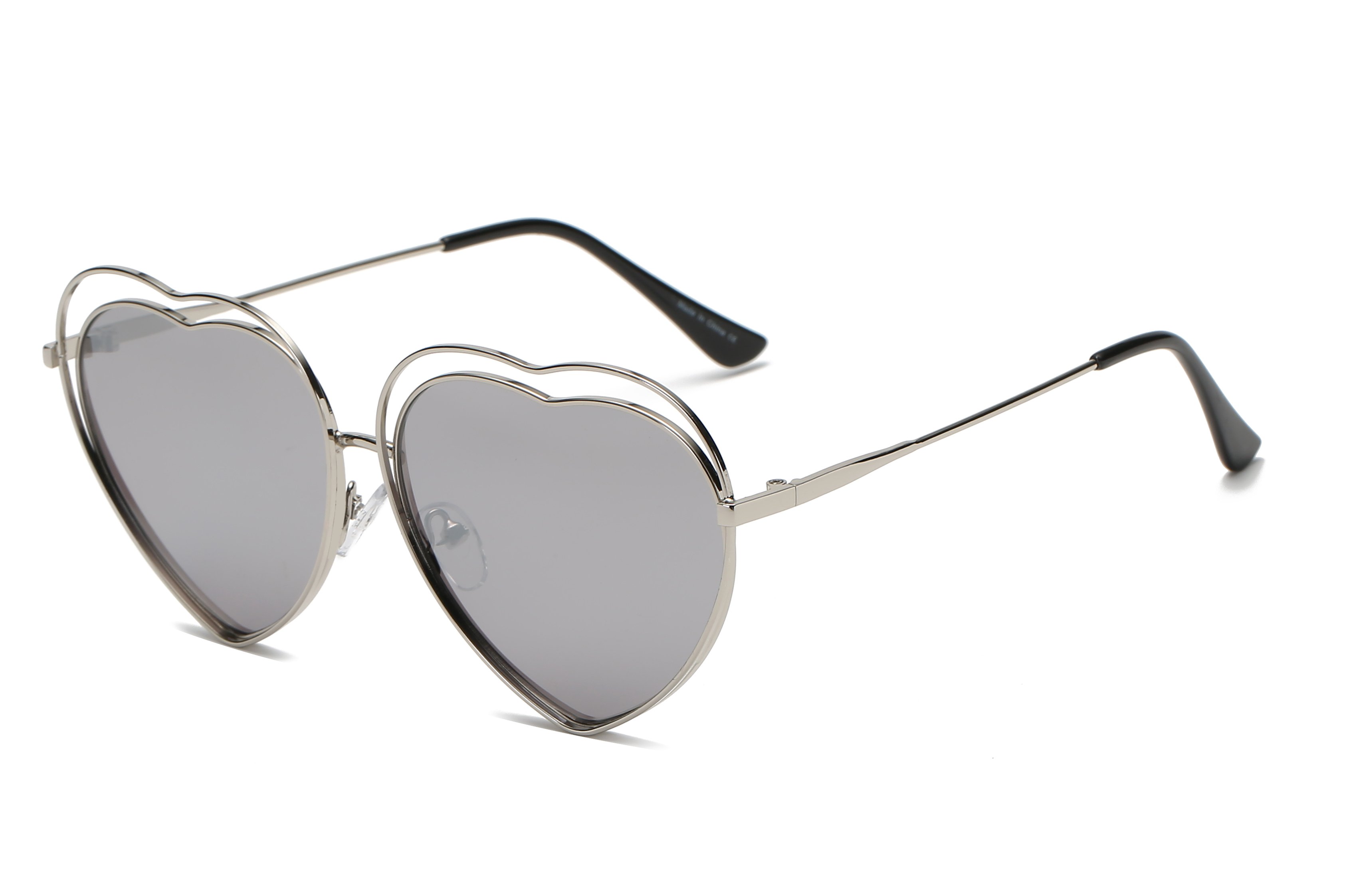 A pair of stylish Astrid heart-shaped sunglasses with mirrored lenses, featuring a metal frame designed for women, offering UV protection.