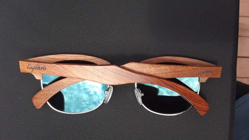 Engleberts Brazilian Pear Wood Sunglasses with Ice Blue Polarized Lenses, showcasing handcrafted design and eco-friendly materials.