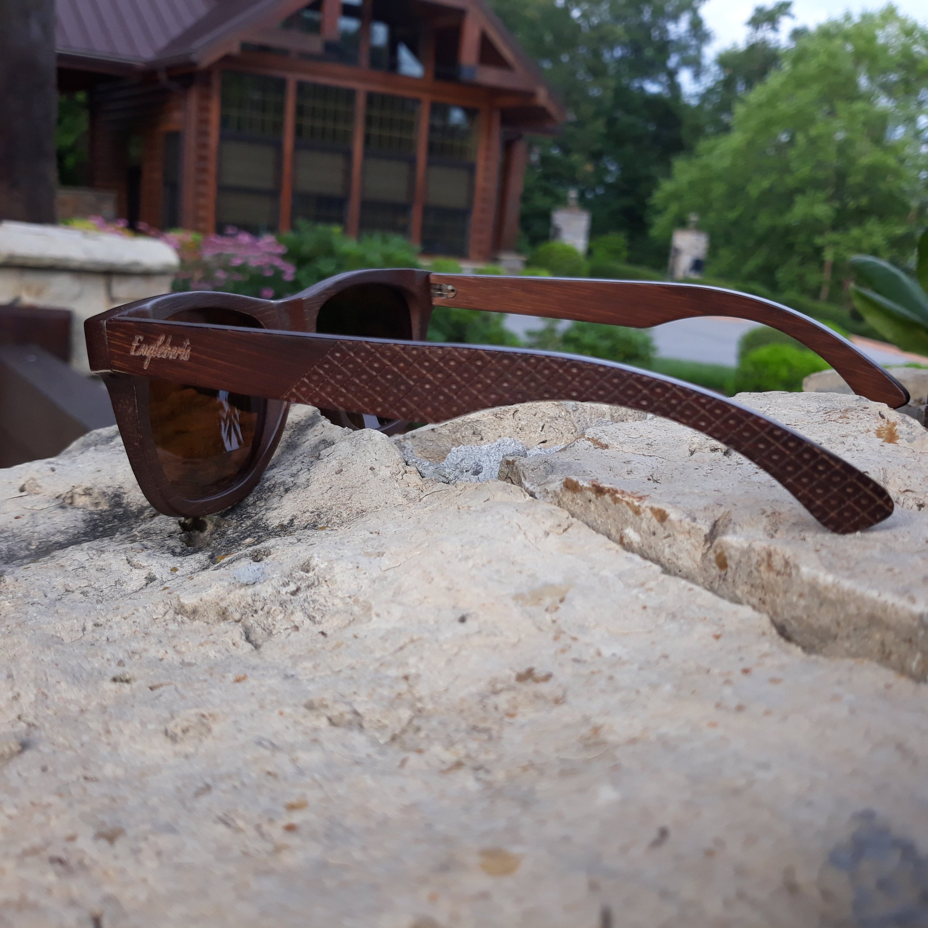 Engleberts Crimson Wooden Sunglasses with tea-colored polarized lenses, showcasing handcrafted wooden frame and stylish design.