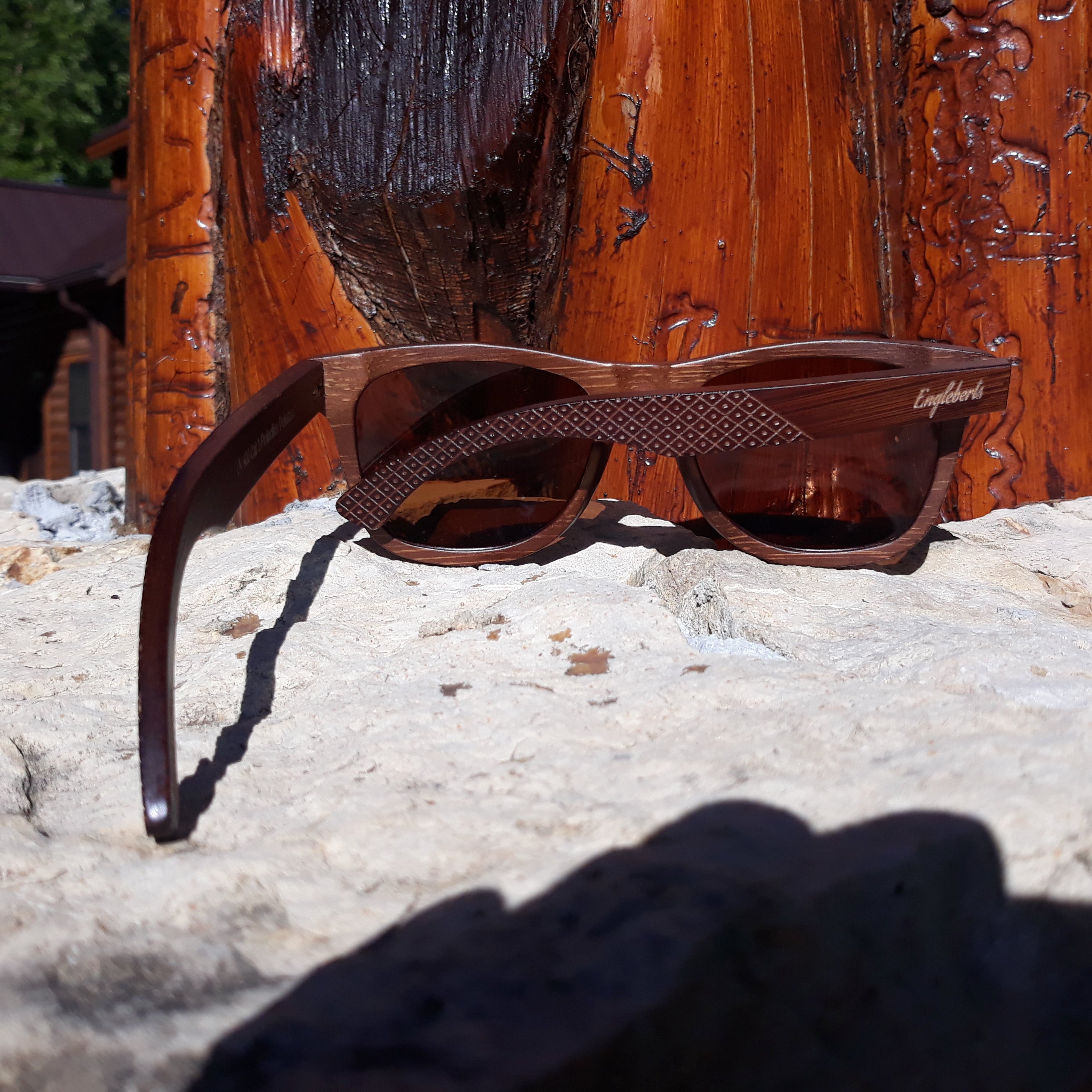 Engleberts Crimson Wooden Sunglasses with tea-colored polarized lenses, showcasing handcrafted wooden frame and stylish design.