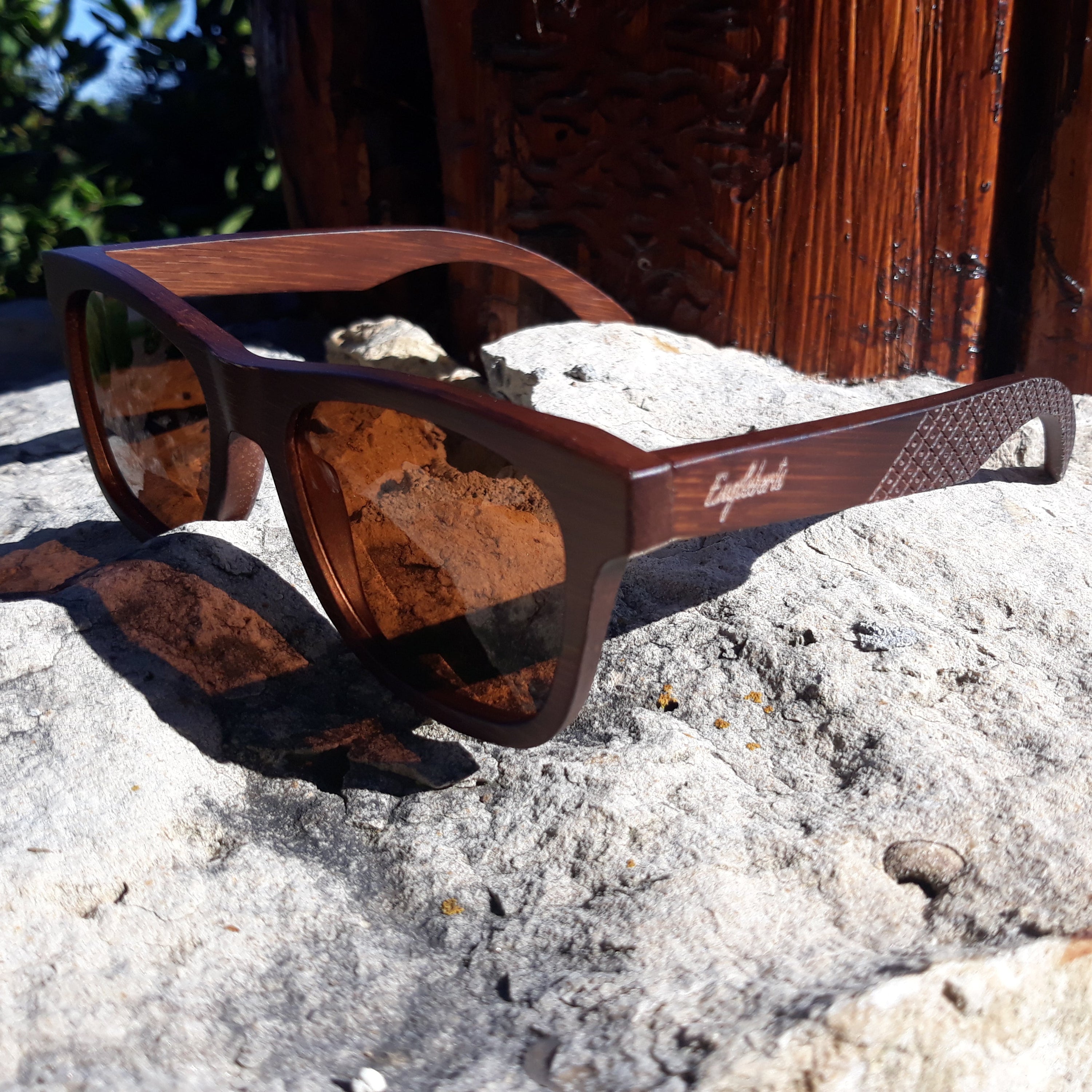 Engleberts Crimson Wooden Sunglasses with tea-colored polarized lenses, showcasing handcrafted wooden frame and stylish design.