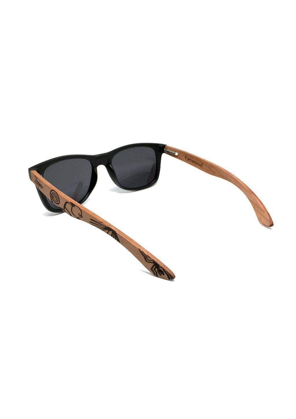 Eyewood engraved wooden sunglasses made from rosewood, featuring a Nazca pattern design on the temples, with polarized black mirror lenses.