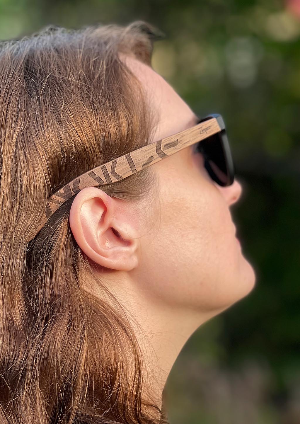 Eyewood engraved wooden sunglasses featuring Viking runes design, made from rosewood and plastic, showcasing a stylish and eco-friendly accessory.