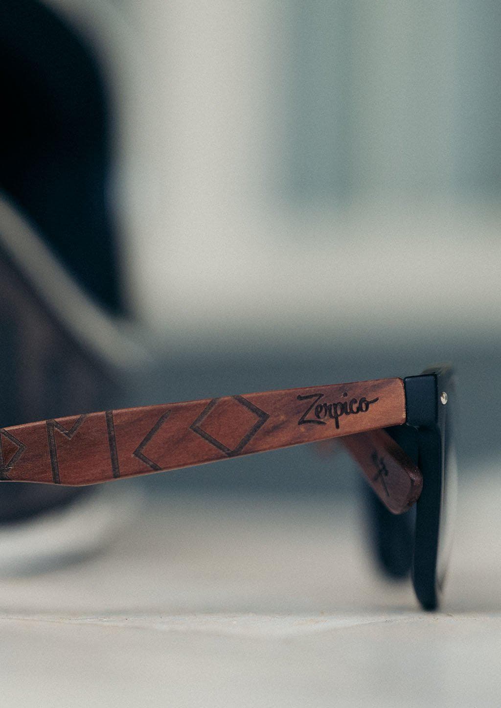 Eyewood Viking Runes engraved wooden sunglasses featuring unique rune scripture on rosewood temples and polarized black lenses.