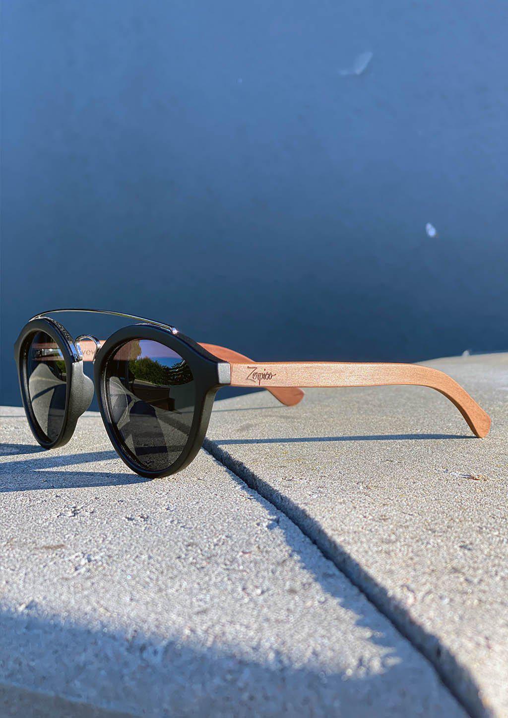 Eyewood Round - Lyric handmade wooden sunglasses featuring polarized grey lenses and unique rosewood design.